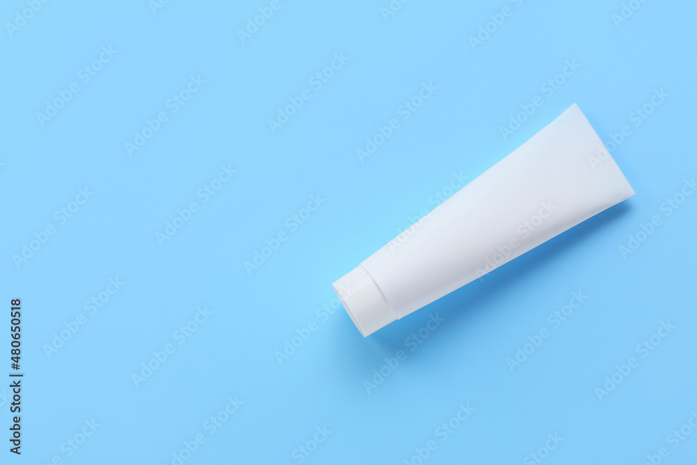 Tube with tooth paste on blue background Tube with tooth paste on blue background