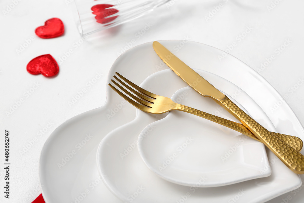 Stylish table setting for Valentine's Day on light background