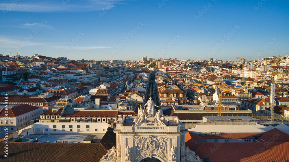 Aerial drone view of the Augusta Street Arch from Commerce Square in Lisbon, Portugal. Sunny day with blue sky.
