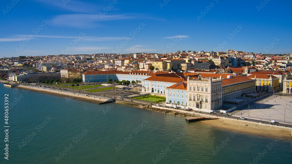 Aerial drone view of the Augusta Street Arch from Commerce Square in Lisbon, Portugal. Sunny day with blue sky.