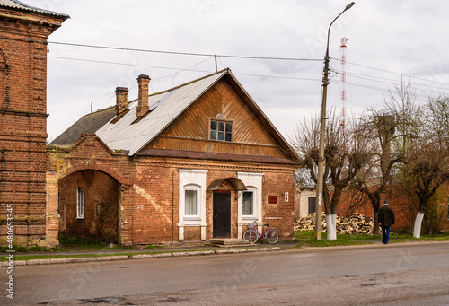 small arch-gate. low-rise houses in the old style. cloudy autumn day in a provincial town