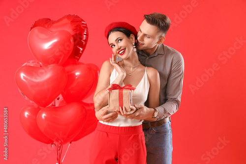 Happy young couple with gif...