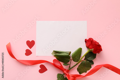 Fototapeta Naklejka Na Ścianę i Meble -  Composition with blank card and rose flower on pink background. Valentine's Day celebration