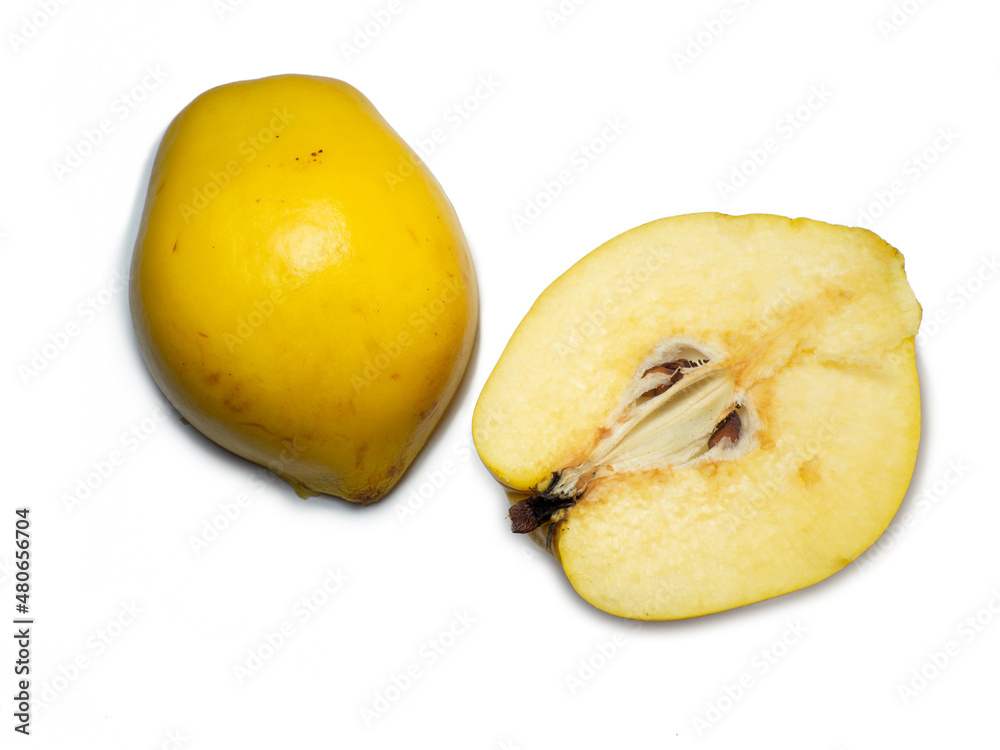 Sliced ​​quince. Juicy fruit on a white background. Ripe useful product. Weathered fruit pulp.