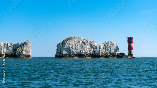 View of The Needles Lighthouse and chalk rocks in Alum Bay, Isle of Wight, United Kingdom photo