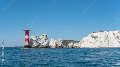 View of The Needles Lighthouse and chalk rocks in Alum Bay, Isle of Wight, United Kingdom photo