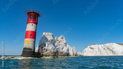 View of The Needles Lighthouse and chalk rocks in Alum Bay, Isle of Wight, United Kingdom