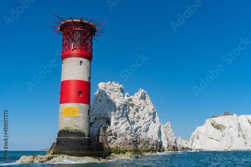 View of The Needles Lighthouse and chalk rocks in Alum Bay, Isle of Wight, United Kingdom photo