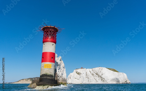 View of The Needles Lighthouse and chalk rocks in Alum Bay, Isle of Wight, United Kingdom