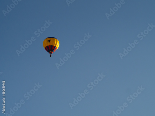 Hot Air Balloon Floating in Clear Blue Sky