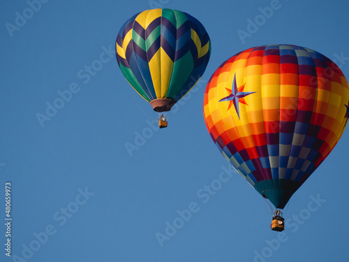Hot Air Balloons Floating in Clear Blue Sky