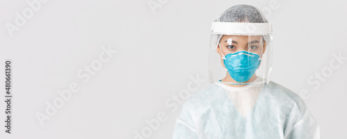 Covid-19, coronavirus disease, healthcare workers concept. Close-up of confident serious-looking female tech lab employee, doctor in personal protective equipment, respirator and face shield photo