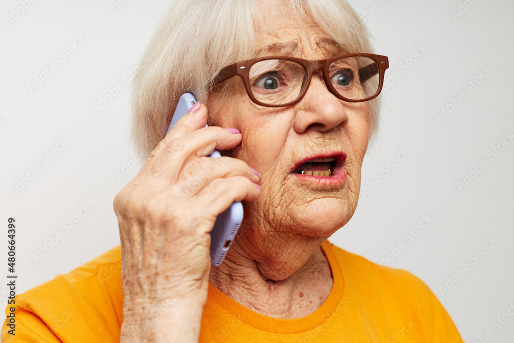 elderly woman happy lifestyle in yellow t-shirts close-up emotions elderly woman happy lifestyle in yellow t-shirts close-up emotions