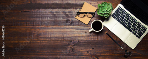 Top view desk flat lay background with computer laptop and office equipment for empty work area copy space concept.