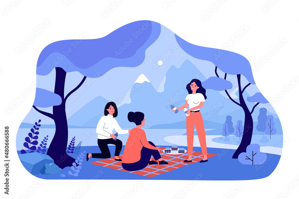 Fototapeta premium Female friends meeting for picnic on river beach in forest
