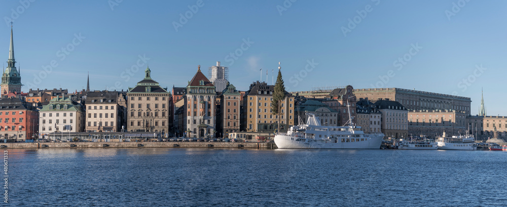 Panorama view of the old town Gamla Stan with churches, castle and old buildings a sunny and snowy winter day in Stockholm