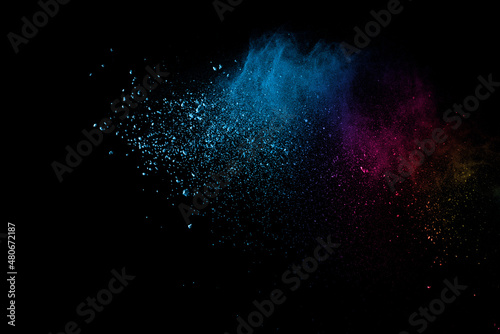 Abstract multicolored powder splatted on white background, Freeze motion of color powder exploding.