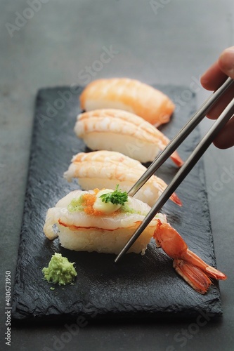 Sushi Set sashimi and sushi rolls served on stone with copy space,Japanese food menu.