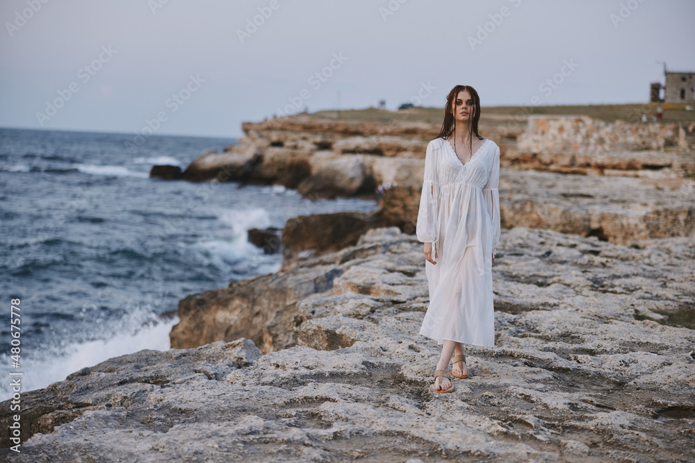 Beautiful woman walks volcanic rock formations on the island Lifestyle unaltered Beautiful woman walks volcanic rock formations on the island Lifestyle unaltered