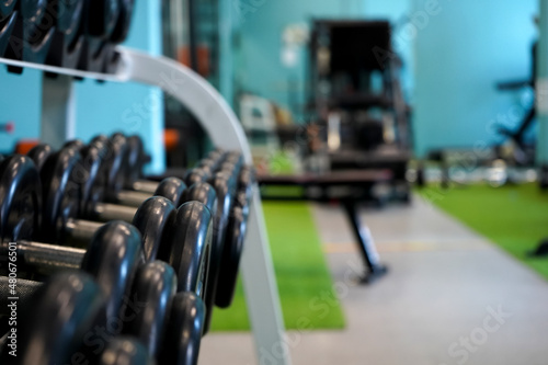 Dumbbells on the background of the gym and exercise equipment.