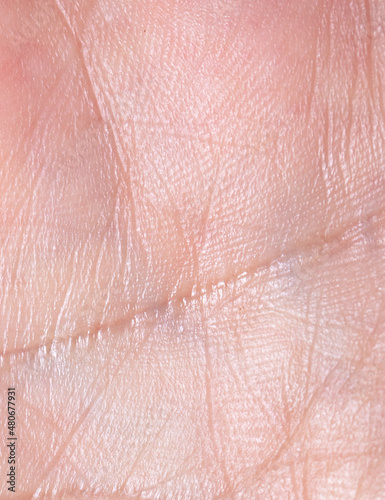 Close-up of lines on human skin as an abstract background.