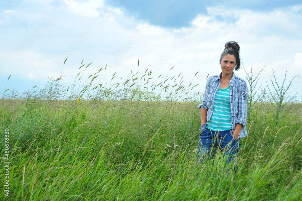 beautiful girl posing in a wheat field. beautiful girl posing in a wheat field.