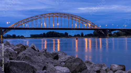 illuminated Waalbrug illuminated in an evening mood