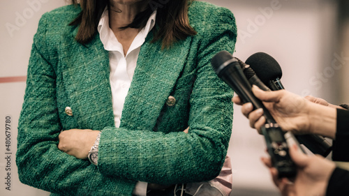 Canvas Print News reporters interviewing a public relations spokesperson