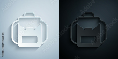 Paper cut Hiking backpack icon isolated on grey and black background. Camping and mountain exploring backpack. Paper art style. Vector