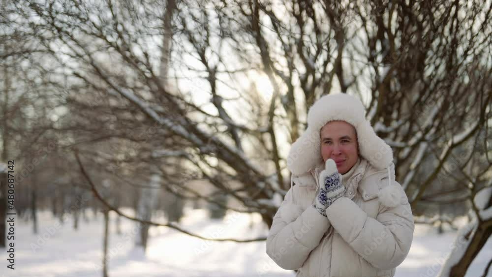 Portrait of a cute homosexual on a winter walk in a city park in warm clothes. Portrait of a cute homosexual on a winter walk in a city park in warm clothes.