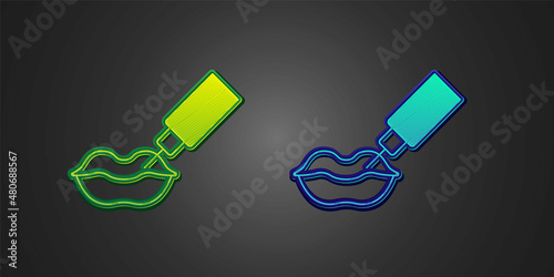 Green and blue Lip augmentation icon isolated on black background. Hyaluronic acid lips injection. Contour plastic. Vector