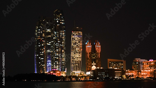 City skyline with big skyscrapers near the beach of Abu Dhabi, United Arab Emirates.