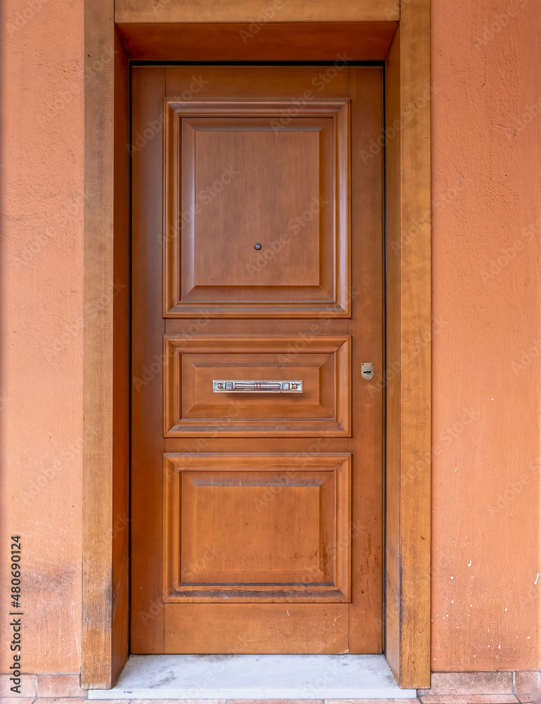 contemporary house simple brown wood door with bronze handle