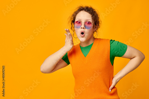 pretty girl orange sweatshirts sunglasses multicolored glasses supply cropped view unaltered