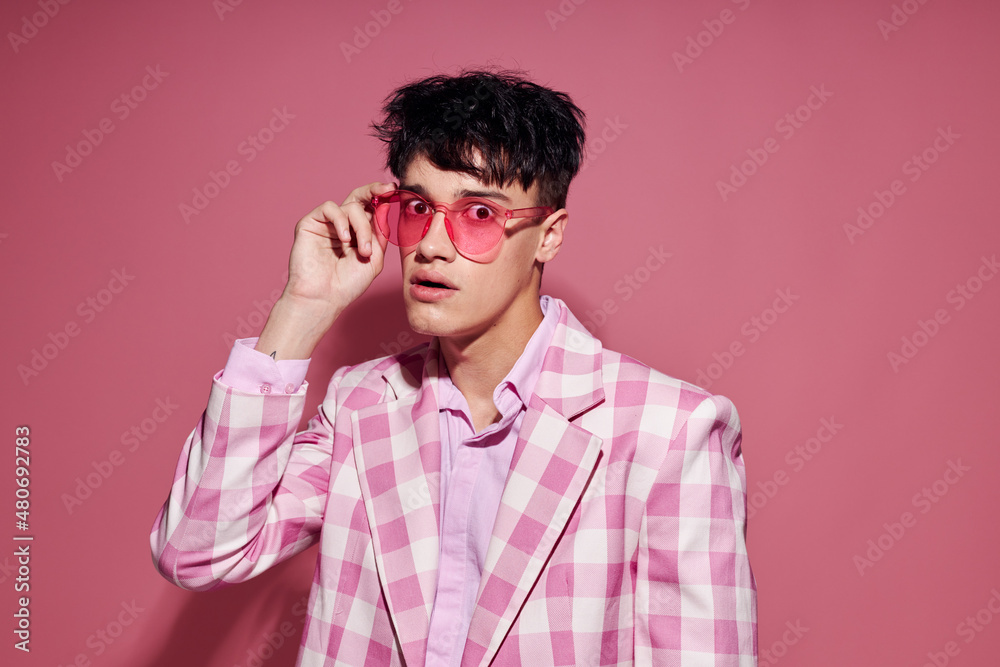 Fototapeta premium pretty man self confidence pink plaid blazer fashion posing isolated background unaltered