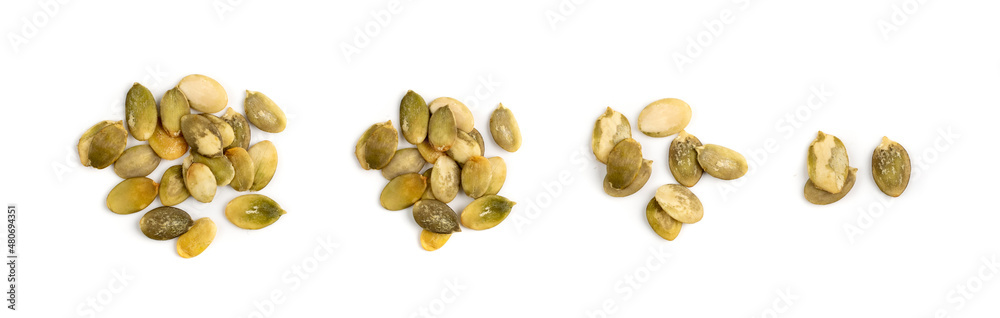 Obraz premium Pumpkin seeds pile isolated on white background top view