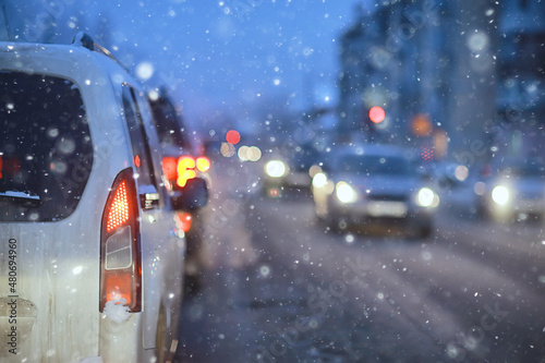 snowfall in city traffic jam in winter, background seasonal snow highway road © kichigin19