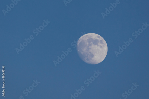 view of the moon during the day . The Moon is Earth s only natural satellite.