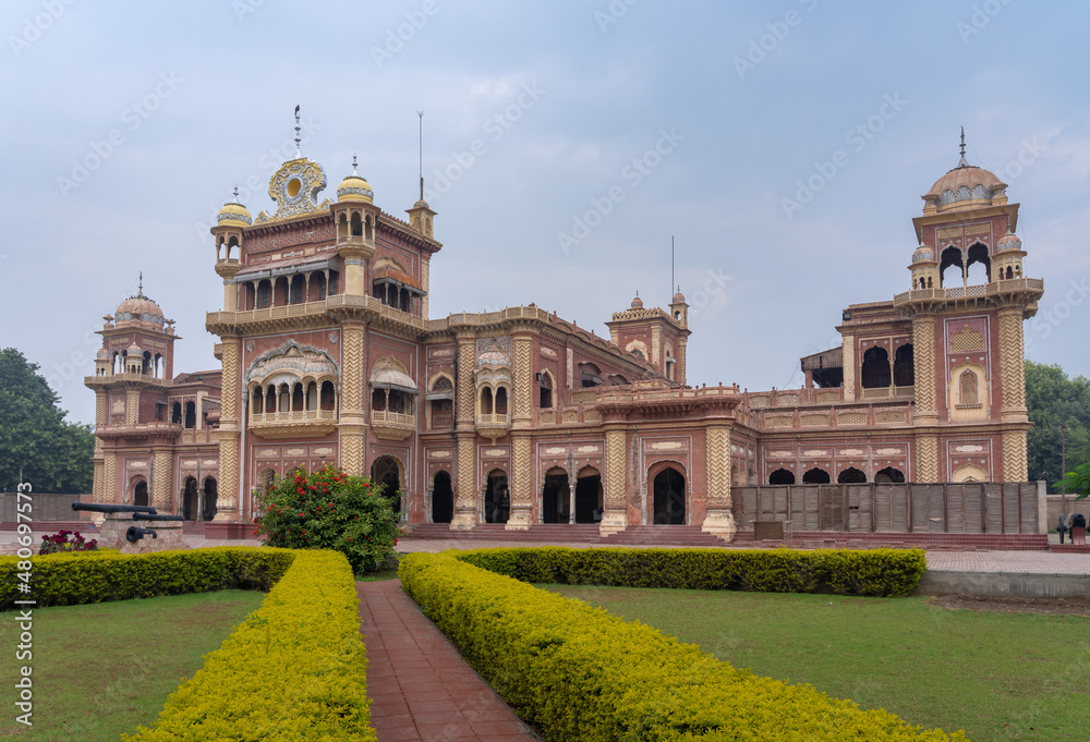 Side view of historic Faiz Mahal palace baroque architecture facade in Khairpur, Sindh, Pakistan from the garden