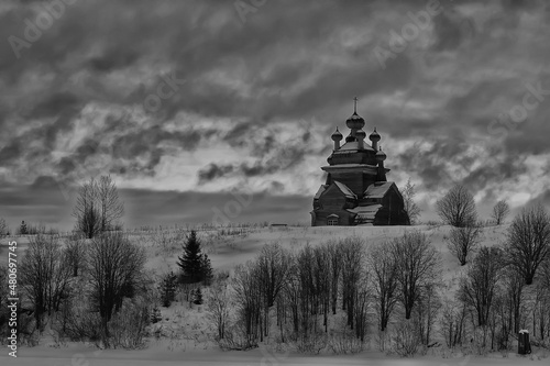 wooden church in the Russian north landscape in winter, architecture historical religion Christianity photo