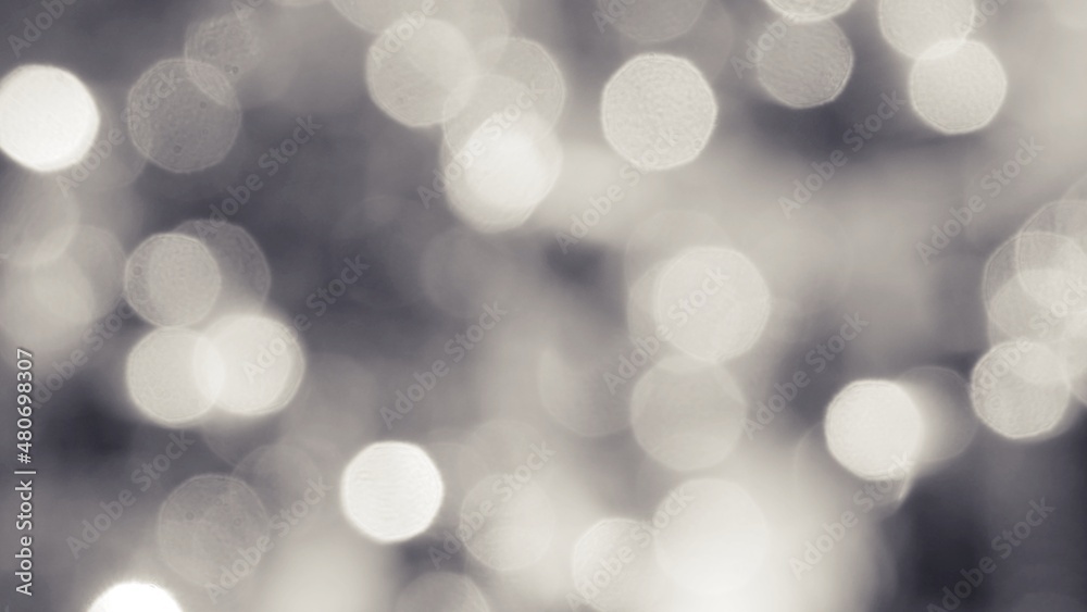 The illuminated white bokeh image can be used as a background illustration or add text. The illuminated white bokeh image can be used as a background illustration or add text.