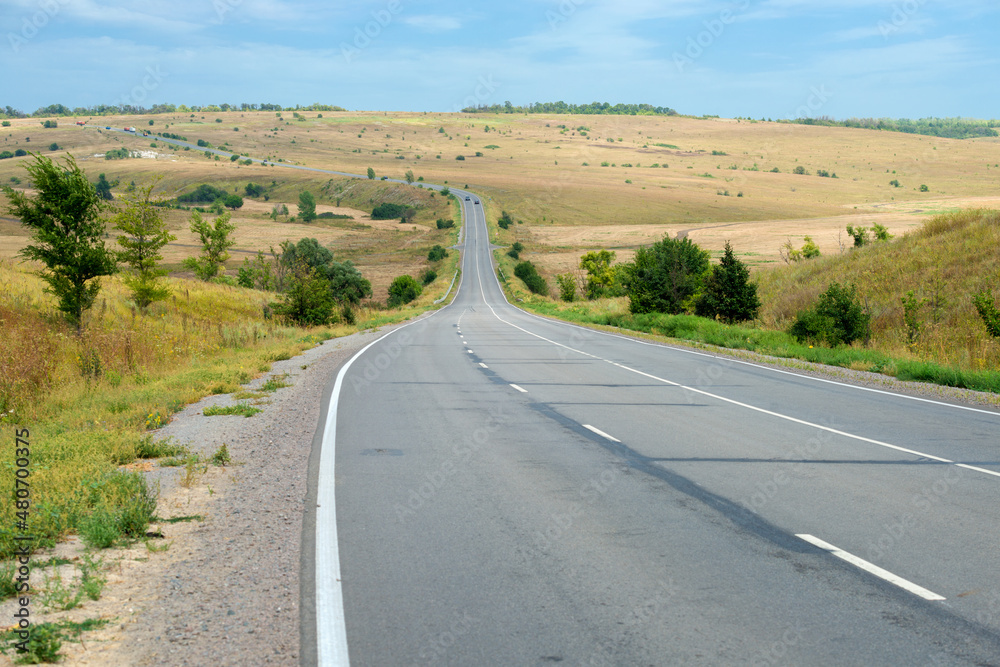 Aerial view of a highway going through agricultural fields in Belogorye, Voronezh region