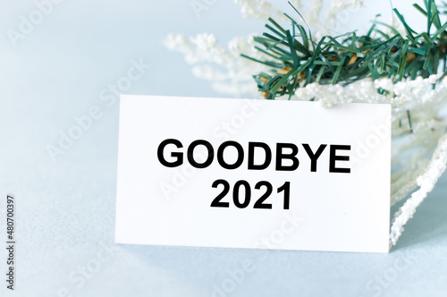Bye, bye 2021 words on a card on a light background