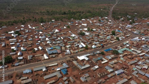 Aerial Larabanga Mosque village fly towards, Mosque is a Muslim mosque built in 1421, the oldest in west Africa and is considered the Mecca of West Africa.  photo