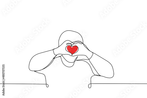 man folded hands in heart shape raising them to level of face - one line drawing vector. Korean gesture "I love you" or "Saranhae"