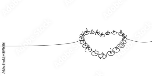 Tea light candles in the shape of a heart continuous line drawing. One line art of memorable date, light, romance, congratulations, love, atmosphere.