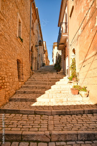 A street among the characteristic houses of Buonalbergo, a mountain village in the province of Benevento, Italy. photo