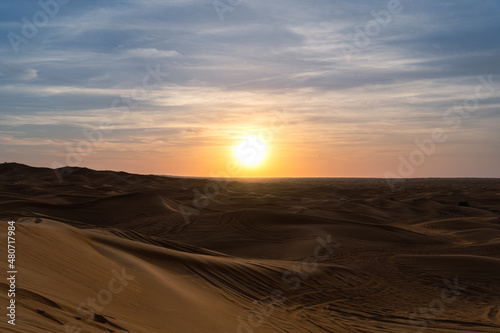 Sunset in the desert over the dunes in Sharjah  UAE