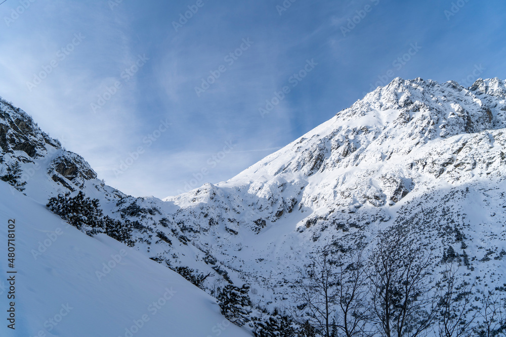 Mountain winter landscape in the Tatras, mountain view covered with snow in frosty sunny weather
