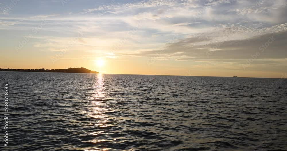 Sunset on boat Freetown Bay Sierra Leone Africa. Hand made wooden fishing fleet. Sierra Leone on the coast of west Africa. Income and industry. Tropical climate, environment from savanna to rainforest Sunset on boat Freetown Bay Sierra Leone Africa. Hand made wooden fishing fleet. Sierra Leone on the coast of west Africa. Income and industry. Tropical climate, environment from savanna to rainforest